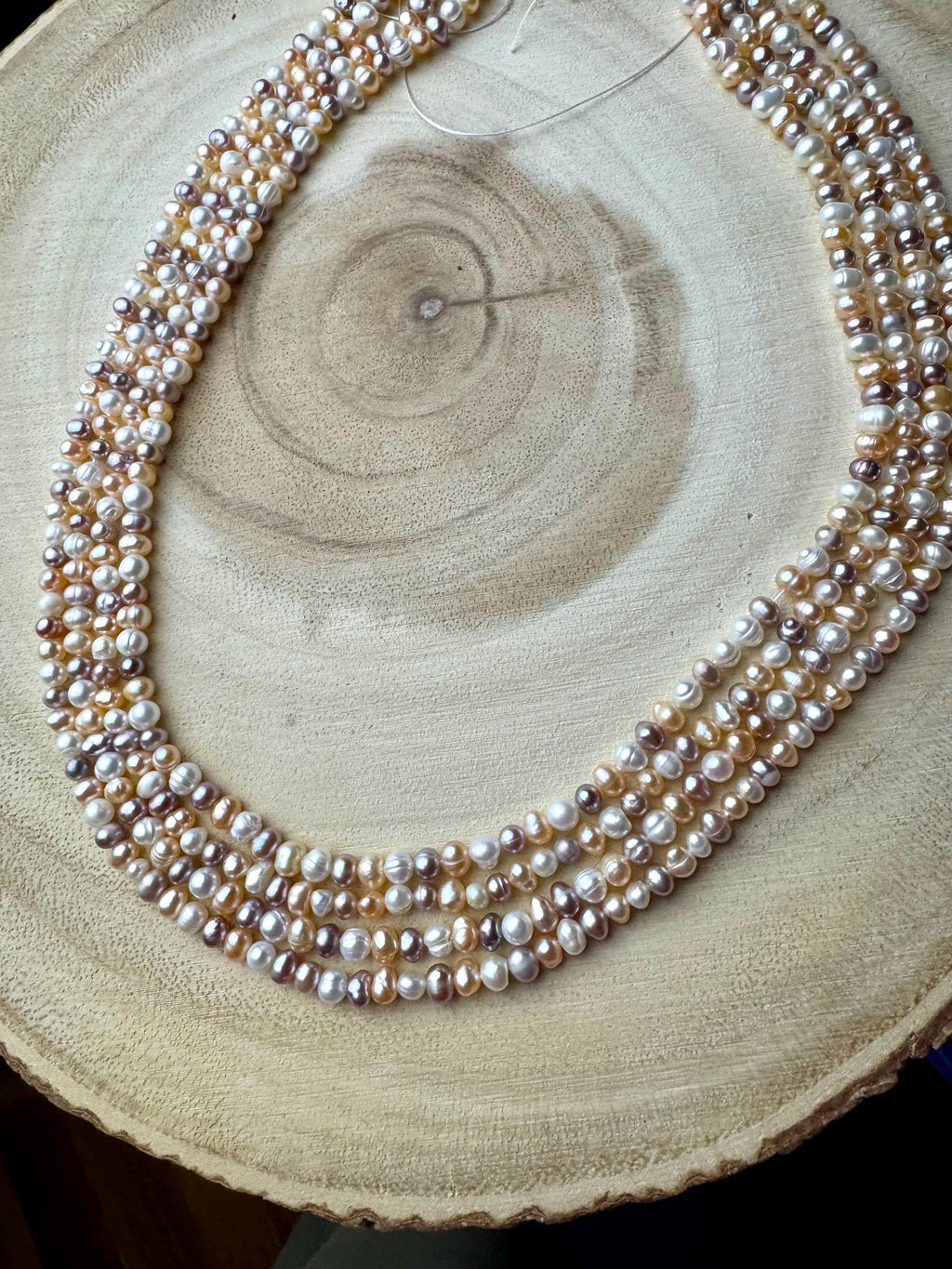Freshwater pearl multi strand necklace. 4-5mm  baroque pearls with gold/silver clasps.