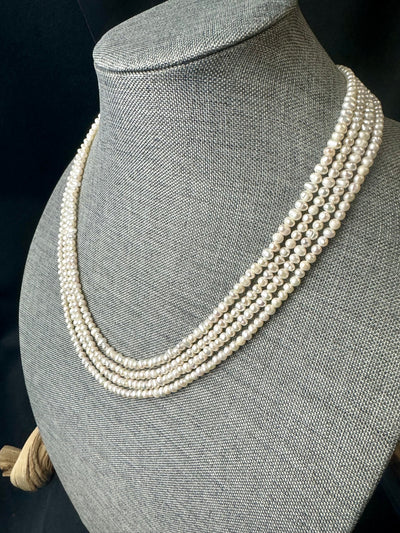 Freshwater pearl multi strand necklace. 4-5mm  baroque pearls with gold/silver clasps.