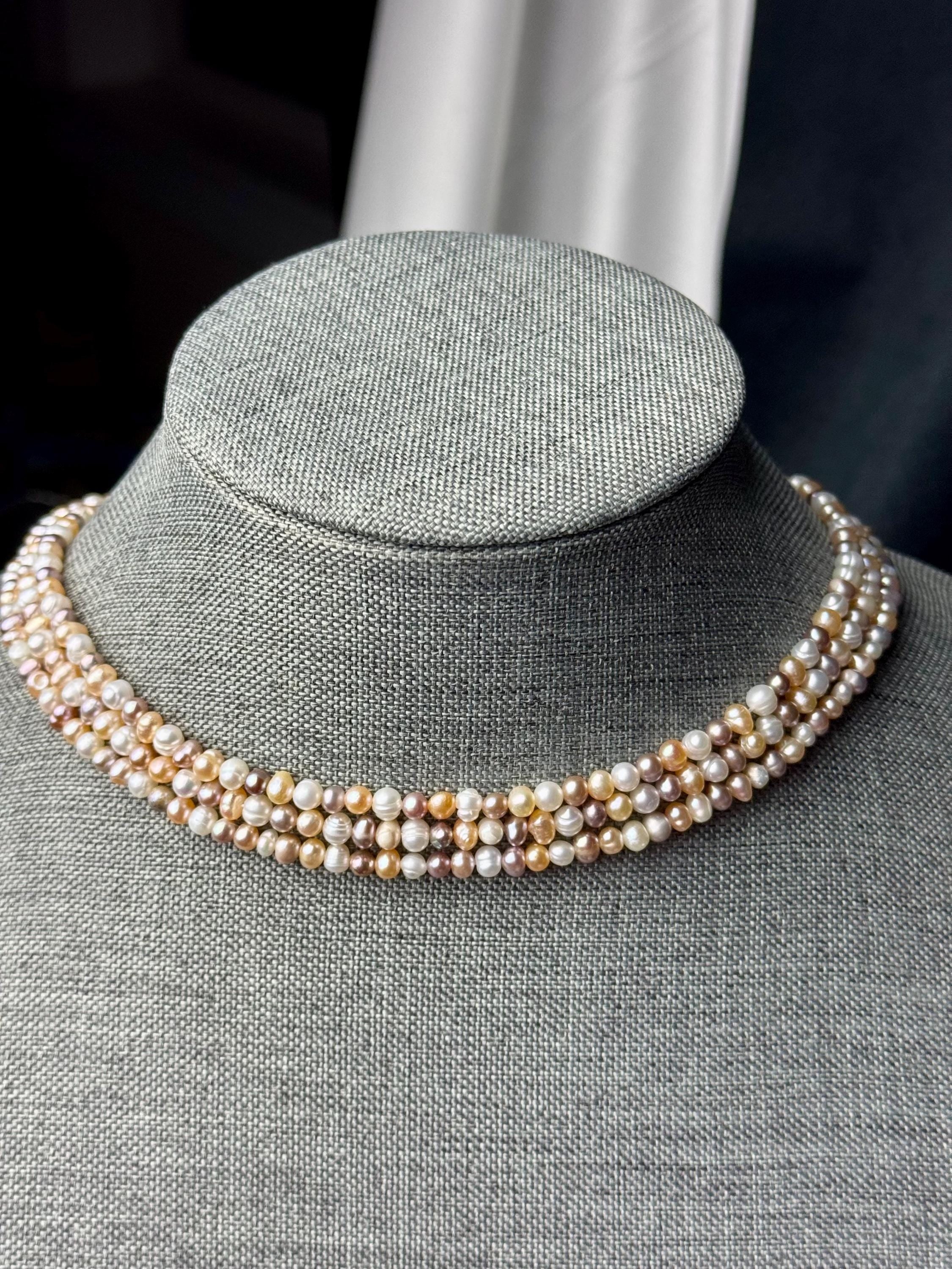 Freshwater pearl multi strand necklace. 4-5mm  baroque pearls with gold/silver clasps.